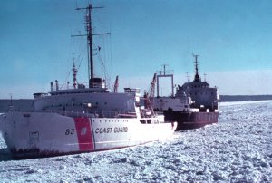 Image of Coast Guard cutter towing ship through ice - 
Click to Enlarge