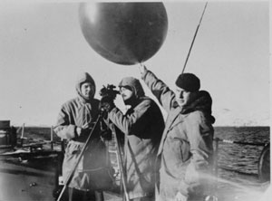 A pilot balloon is launched from a U.S. Coast Guard vessel