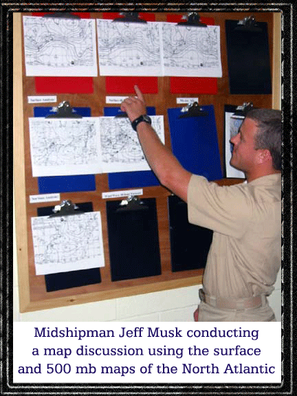 Midshipman Jeff Musk conducting a map discussion using the surface and 500 millibar maps of the North Atlantic